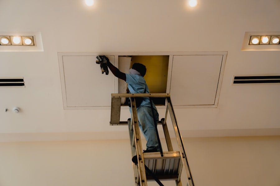 Vents2Clean technician cleaning an air duct in a Manalapan NJ home